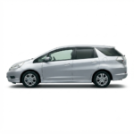 Side profile of the 2010 Honda Fit G Silver hatchback